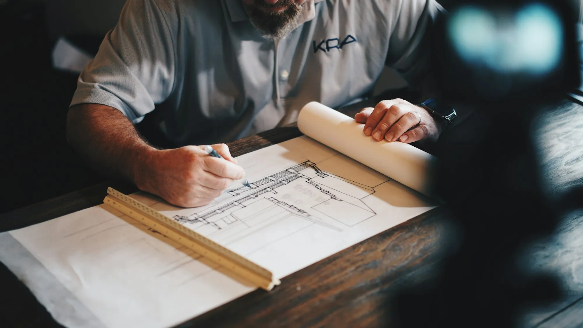 Drawing interior plans at a timber desk