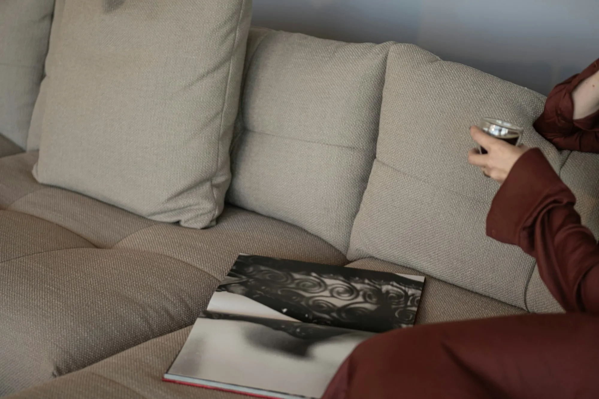 Linen sofa with a design book